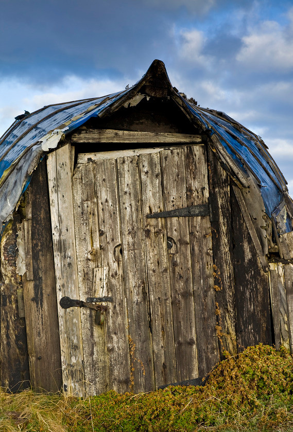 Holy Island Lindisfarne Fishermans Boat House-8465 
 Fishermans boat house on the Holy Island of Lindisfarne Northumbria. 
 Keywords: Holy Island, Lindisfarne, fishermans boat house, Northumbria, decaying, shed,