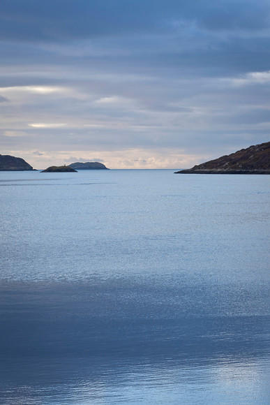 Lochinver, Sutherland 
 Winter light reflecting offshore from Lochinver in Sutherland. 
 Keywords: Sutherland, Lochinver, Scotland, west coast, light, blues, Alba Landscapes, Ron Walsh,File 8377